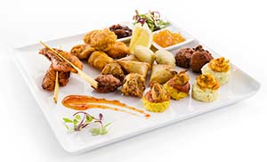 Brakes Indian platter contains vegetable pakora 15 onion bhaji vegetable samosa and aloo tikki